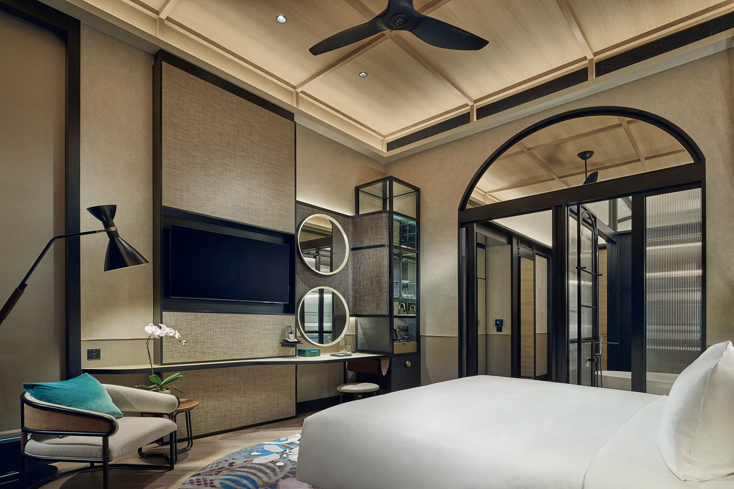 Cozy boutique hotel room with soft linens and ambient lighting at Artyzen.