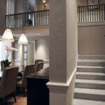 Elegant Capella villa suite featuring open-plan living area, and lush surroundings.