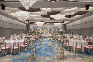 Pan Pacific Hotel indoor wedding celebration with high ceilings, grand floral displays, and refined decor.