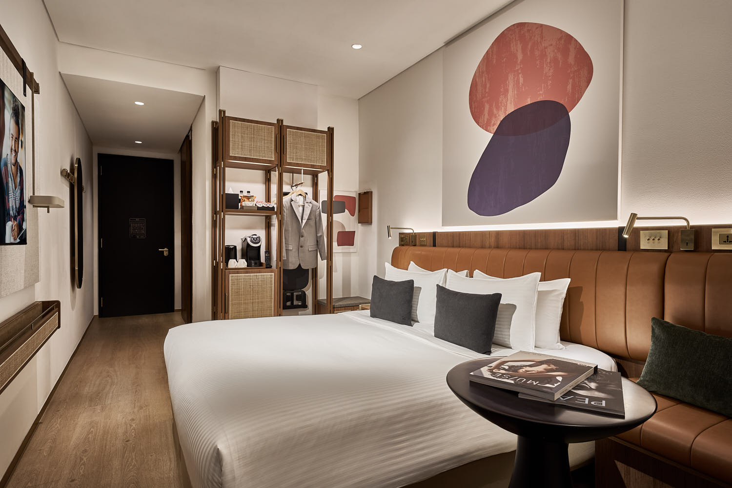 Citadines Connect hotel room with neutral tones, large windows, and stylish decor.