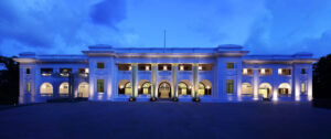 Stunning colonial architecture of Changi Cove Hotel Singapore illuminated in the soft glow of evening light.