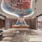 Bright and welcoming hotel lobby at Capri Hotel Singapore with artistic accents.