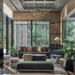 Front entrance of Adina Hotel Singapore, showcasing sleek glass doors and welcoming lobby area.