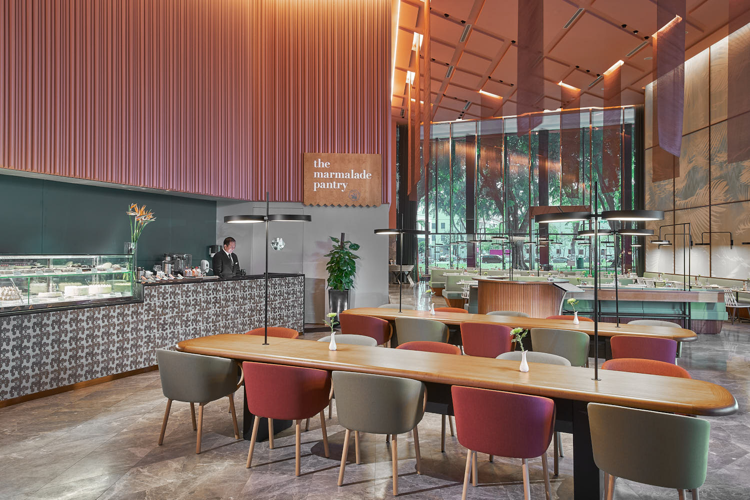 Chic dining space at Oasia Downtown Hotel with a warm, inviting atmosphere.