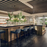 Hilton Hotel wedding reception with long banquet tables, floral centerpieces, and soft ambient lighting.
