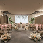 Hilton indoor wedding solemnization with a luxury altar, floral arrangements, and cozy seating.