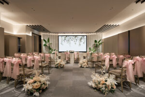 Hilton indoor wedding solemnization with a luxury altar, floral arrangements, and cozy seating.