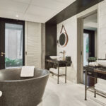 Elegant bathroom with a freestanding bathtub and sophisticated fixtures at The Barracks Sentosa.
