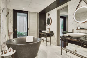Elegant bathroom with a freestanding bathtub and sophisticated fixtures at The Barracks Sentosa.