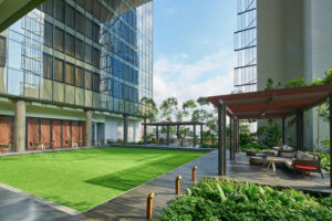 Expansive terrace at Oasia Downtown with panoramic city views and stylish outdoor seating.