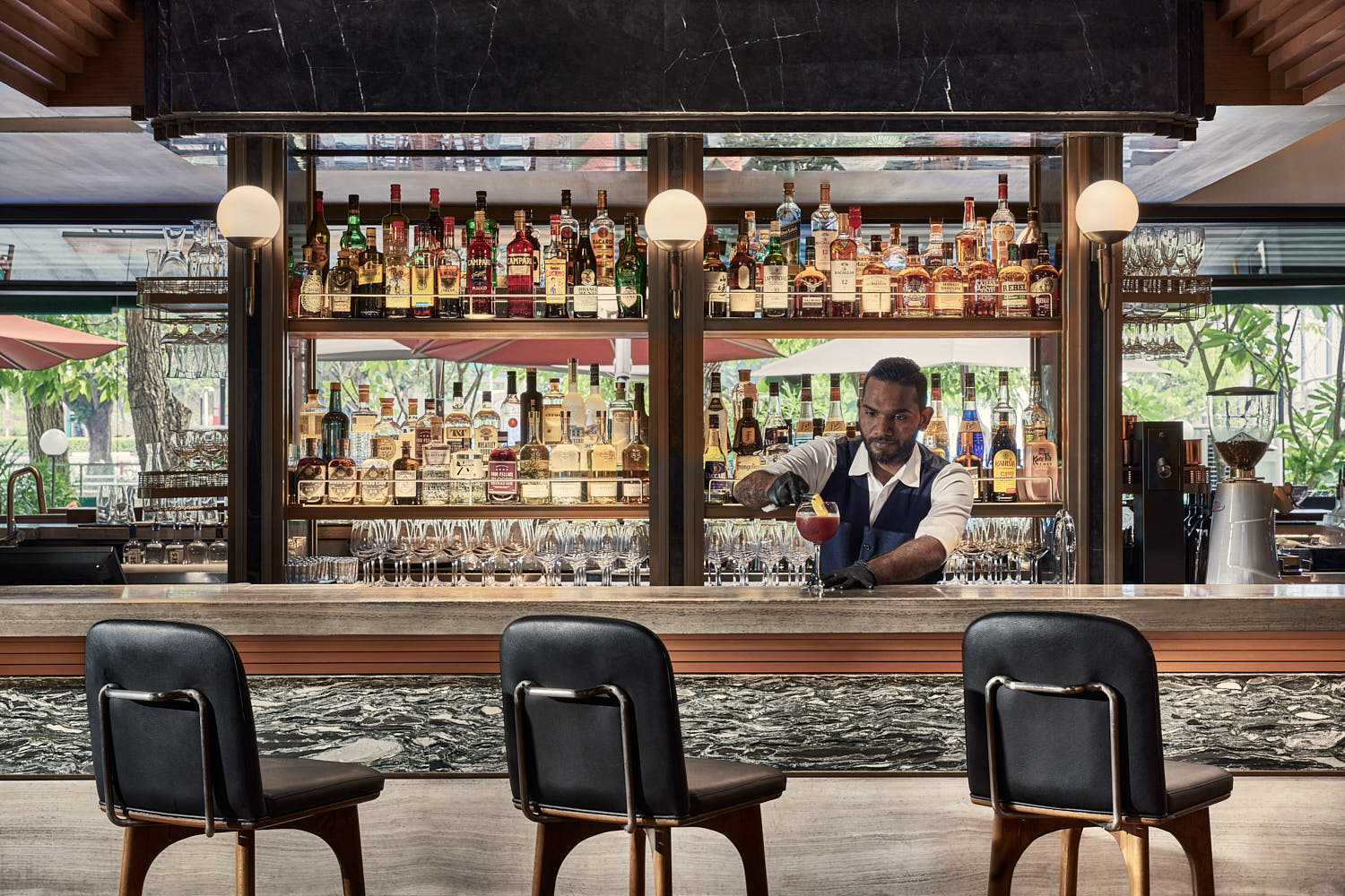 Rustic indoor bar at InterContinental Hotel with crafted cocktails.