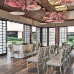 Intimate outdoor wedding ceremony space at Pan Pacific Hotel Singapore with lush greenery.