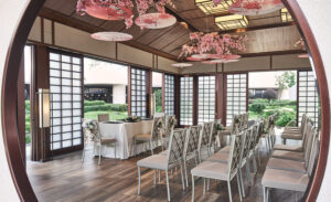 Intimate outdoor wedding ceremony space at Pan Pacific Hotel Singapore with lush greenery.
