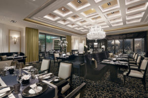 Upscale dining ambiance at Joel Robuchon restaurant with plush chairs and soft lighting.