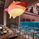 Fish Pool at JW Marriott Singapore offers sashimi, crudo, and ceviche by an Olympic diving pool.