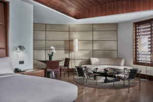 Spacious hotel room at Marriott with contemporary design and cozy seating area.