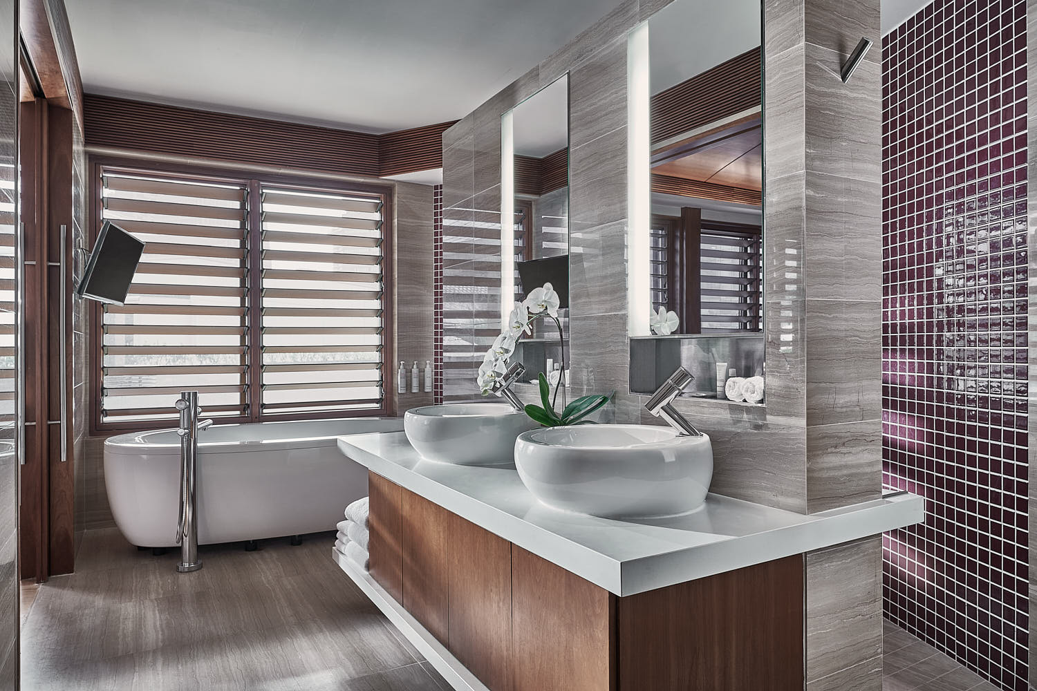 Exquisite bathroom design at Marriott Hotel Singapore, featuring a double vanity, spa-like atmosphere, and high-end fixtures.