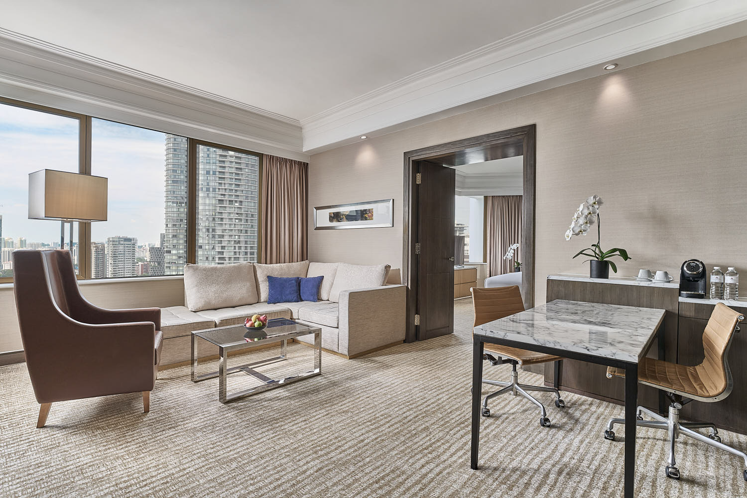 Luxurious living room at Marriott Hotel Singapore, featuring a cozy sitting area and tastefully designed interiors.