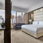 Well-appointed suite at Marriott Tang Plaza Hotel, offering a blend of comfort and luxury with a city view.