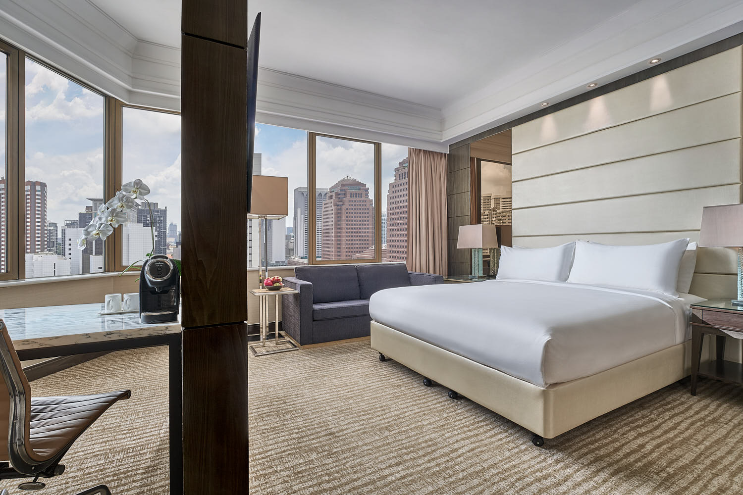 Well-appointed suite at Marriott Tang Plaza Hotel, offering a blend of comfort and luxury with a city view.