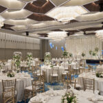 Pan Pacific Hotel indoor wedding setup with plush seating, chandeliers, and an elegant floral arrangements.