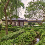 Serene landscaped garden with water features at Pan Pacific Hotel Singapore.