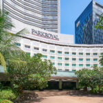 PARKROYAL sophisticated facade with a blend of glass, steel, and sleek minimalist design.