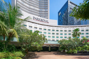 PARKROYAL sophisticated facade with a blend of glass, steel, and sleek minimalist design.