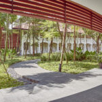 Capella Hotel terrace surrounded by lush tropical gardens.
