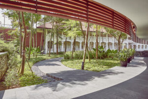 Capella Hotel terrace surrounded by lush tropical gardens.