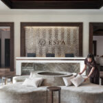 Serene spa experience at ESPA with elegant decor, calming water features, and spa essentials.