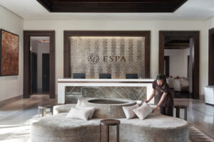 Serene spa experience at ESPA with elegant decor, calming water features, and spa essentials.