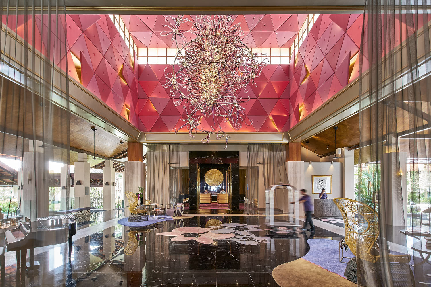 Bright and airy hotel lobby at Sofitel Singapore with a modern artistic aesthetic.