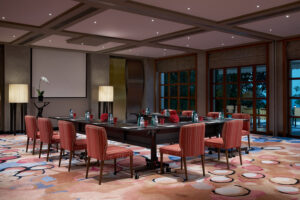 Sofitel Resort meeting room with collaborative workspace and comfortable chairs.