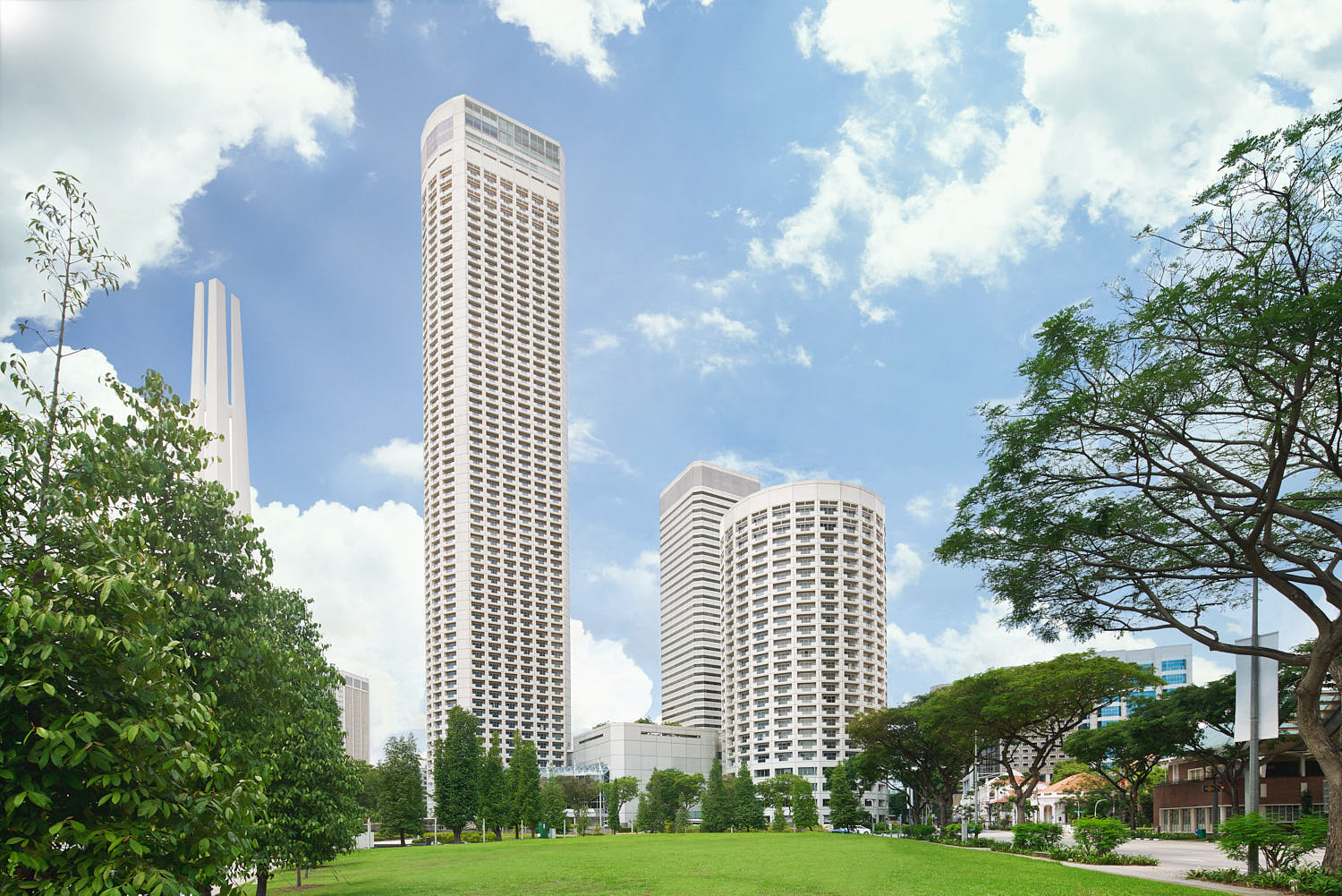 Swissotel Singapore from afar, showcasing its timeless facade and impressive height in the cityscape.