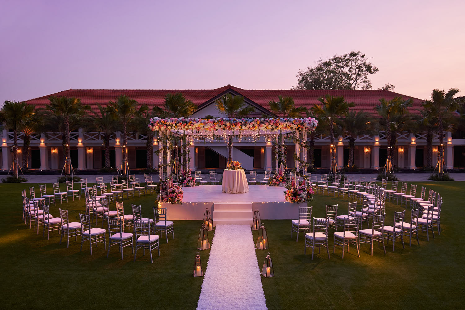 Serene outdoor wedding venue at The Barracks Hotel with breathtaking views and candle-lit pathways.