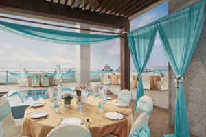 Intimate wedding solemnization at Oasia Hotel with stylish chairs, delicate floral arrangements, and natural lighting.