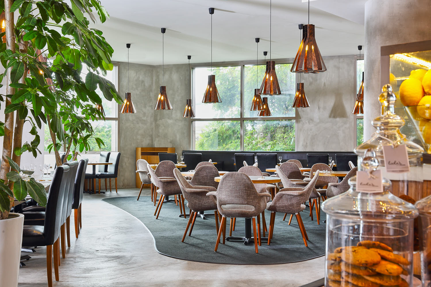 Contemporary interior of Awfully Chocolate restaurant with clean lines and dark chocolate tones.