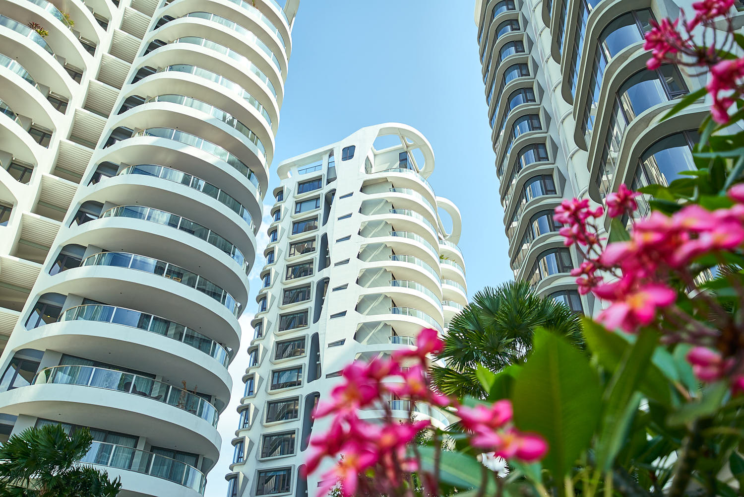 Full view of Cape Royale’s architectural profile rising over Sentosa Cove.