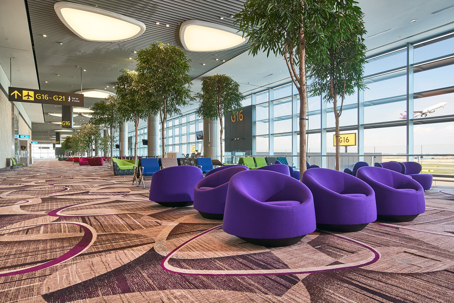 Colours accents and wide walkways enhance the relaxed airport experience.