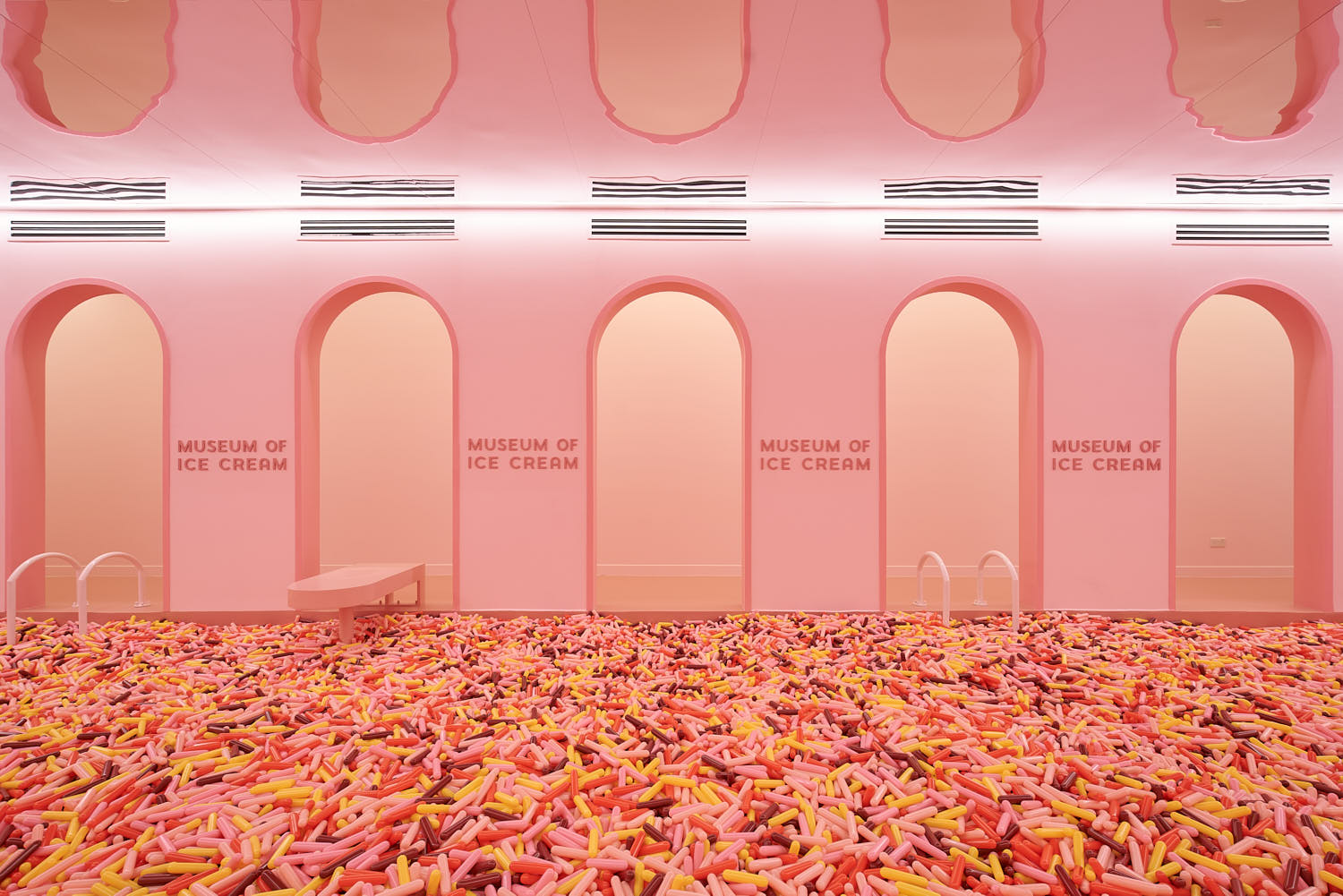 Iconic sprinkle pool at the Museum of Ice Cream filled with pastel-colored balls.